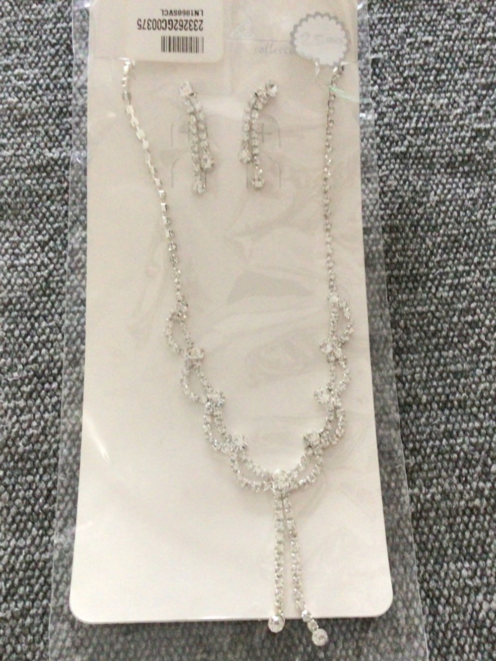 NWT pierced rhinestone earrings and necklace set